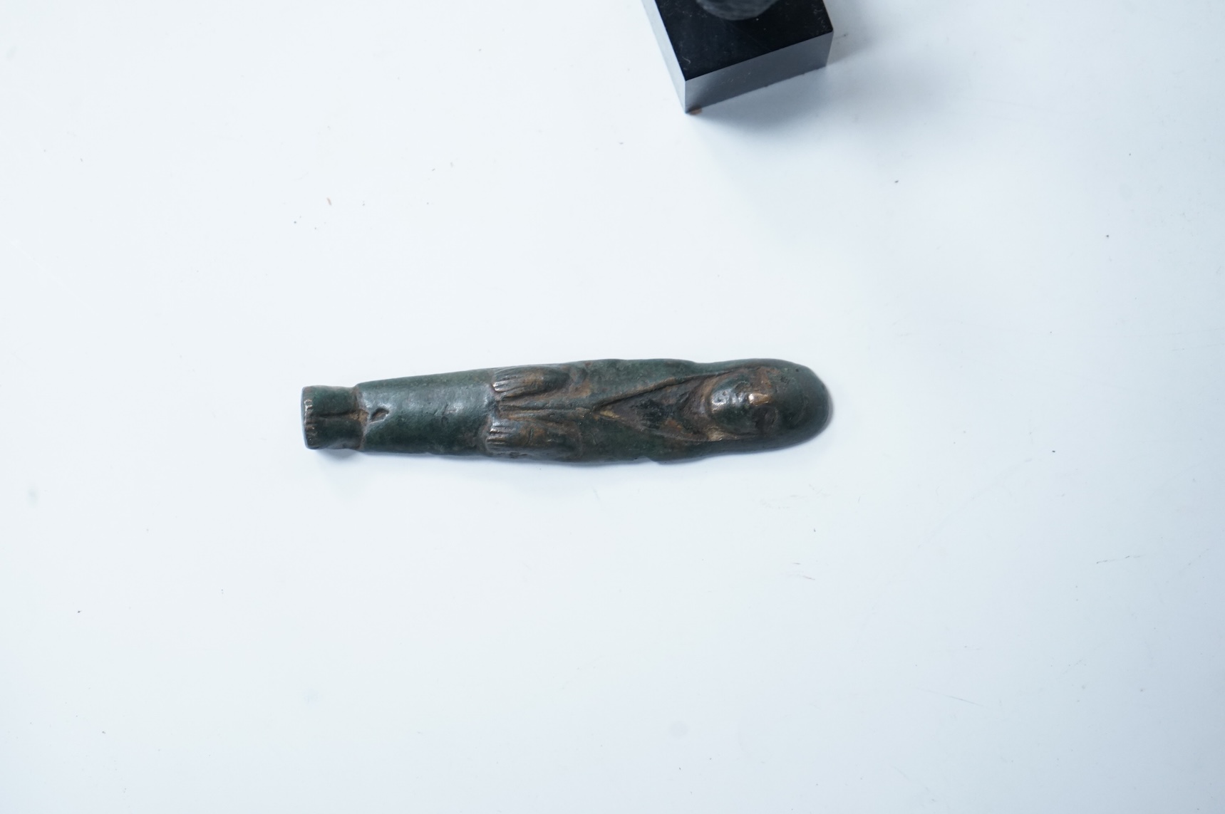 Two small antiquities with certificates - an Assyrian obsidian head of Pazuzu and a Celtic bronze offer idol